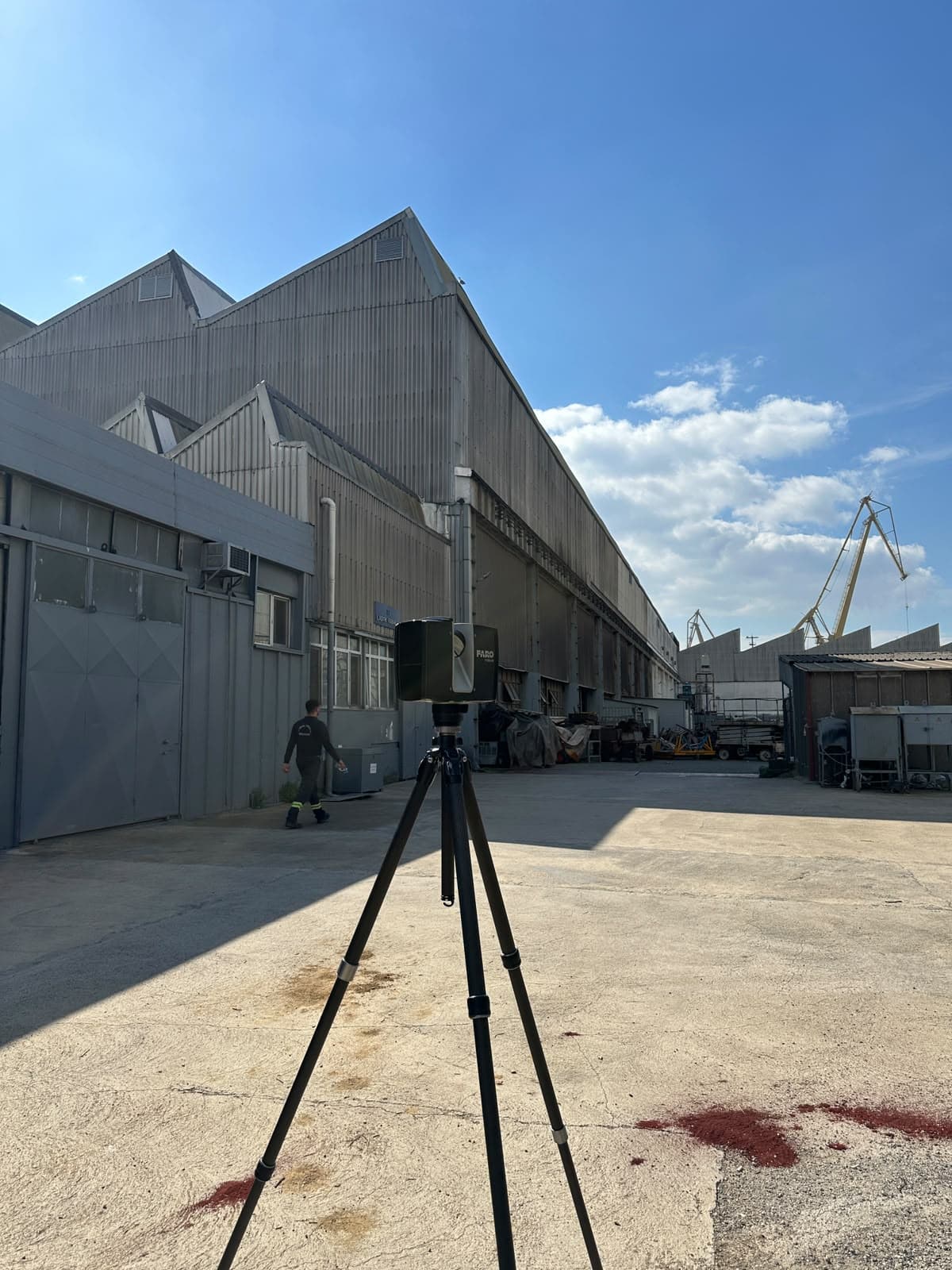 FARO scanner capturing the steel fabrication plant's corrugated metal exterior facade ahead of renovation